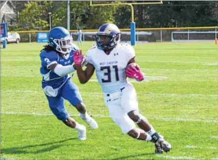  ?? MICHAEL REEVES — FOR DIGITAL FIRST MEDIA ?? Cheyney’s Samuel Anojulu pushes out West Chester’s Mark Dukes earlier this season. The school announced Thursday that the Wolves will disbandon their football program.