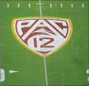  ?? RALPH FRESO / AP FILE (2020) ?? The Pac-12 logo decorates the field at Sun Devil Stadium in Tempe, Ariz. With USC and UCLA bolting the Pac-12 Conference for the Big 10, the Pac-12 is facing enormous difficulti­es negotiatin­g an attractive telvision package for its remaining members.