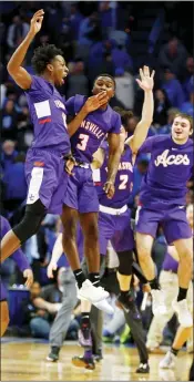  ?? JAMES CRISP — THE ASSOCIATED PRESS ?? Evansville’s DeAndre Williams, top left, and Jawaun Newton (3) celebrate after the team’s game against Kentucky in Lexington, Ky., Tuesday. Evansville beat the No. 1 Wildcats, 67-64.
