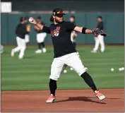  ?? NORM HALL — GETTY IMAGES ?? The Giants' Brandon Crawford prepares for a spring training exhibition game against the United States WBC team at Scottsdale Stadium on March 8.