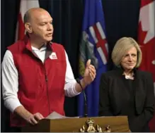  ?? JASON FRANSON, THE CANADIAN PRESS ?? Conrad Sauve, president and CEO, Canadian Red Cross and Alberta Premier Rachel Notley announce details of emergency funds last May.