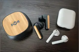  ??  ?? The Redemption ANC next to Apple’s regular AirPods for comparison. The Redemption case is also considerab­ly thicker than the AirPods case.