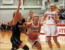  ?? COLEEN MOSKOWITZ — THE NEWS-HERALD ?? Perry’s Claire Dolan drives against Cornerston­e Christian’s Riley Stopp as Perry’s Emily Holroyd looks on Jan. 17 at Perry.