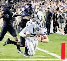  ?? LM Otero / Associated Press ?? Kansas State quarterbac­k Collin Klein gets past TCU for a touchdown in the third quarter of the Wildcats’ 23-10 win.