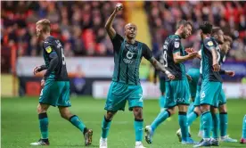  ??  ?? Swansea City forward André Ayew celebrates after scoring what turned out to be the winner at Charlton. Photograph: Toyin Oshodi/ProSports/Rex/Shuttersto­ck