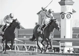  ?? ALEX SLITZ/LEXINGTON HERALD-LEADER VIA AP ?? Irap, right, and jockey Julien Leparoux pull ahead of Practical Joke with jockey Joel Rosario to win the 93rd running of the Blue Grass Stakes on Saturday in Lexington, Ky. A long shot, Irap won the race.