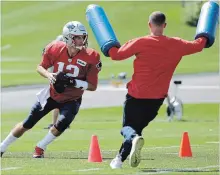  ?? STEVEN SENNE
THE ASSOCIATED PRESS ?? Tom Brady works on his pocket awareness during a New England Patriots workout on Wednesday. Brady is entering his 19th NFL season.