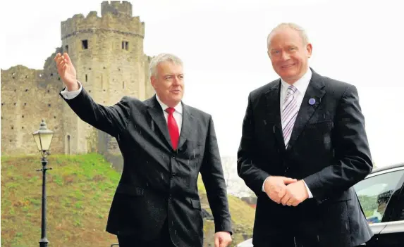  ?? Richard Swingler ?? > First Minister Carwyn Jones, left, welcomes Martin McGuinness, then deputy First Minister of Northern Ireland, to Wales in November 2012