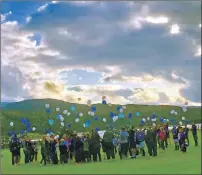  ??  ?? Players and supporters release blue and white balloons at Canal Parks in tribute to Martin.