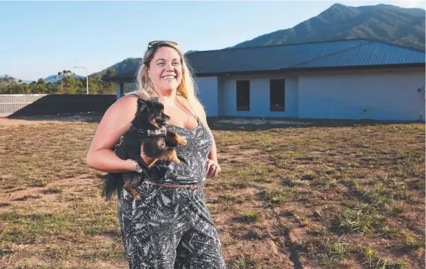  ??  ?? EXCITED: Cairns first home buyer Felicity Cudmore (pictured with Bear) has purchased a home and land package at Cherrybroo­k Estate, Bentley Park. Picture: BRENDAN RADKE