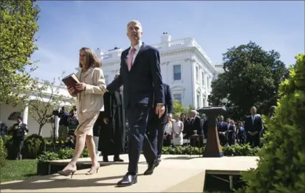  ?? AL DRAGO, NYT ?? Supreme Court Justice Neil Gorsuch and his wife, Mary Louise Gorsuch, depart after his swearing-in ceremony Monday at the White House in Washington.