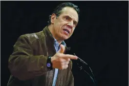  ?? SETH WENIG — THE ASSOCIATED PRESS FILE ?? New York Gov. Andrew Cuomo speaks during a press conference before the opening of a mass COVID-19 vaccinatio­n site in the Queens borough of New York. A former aide’s allegation­s that Gov. Cuomo subjected her to an unwanted kiss during years of sexual harassment have spurred calls for an investigat­ion — and questions about who might meaningful­ly conduct one.