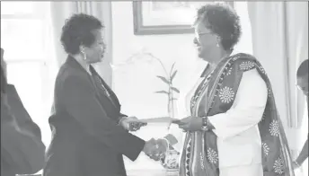  ?? (TeleSUR photo) ?? Prime Minister Mia Mottley (right) receiving the instrument of office from Governor General Dame Sandra Mason.