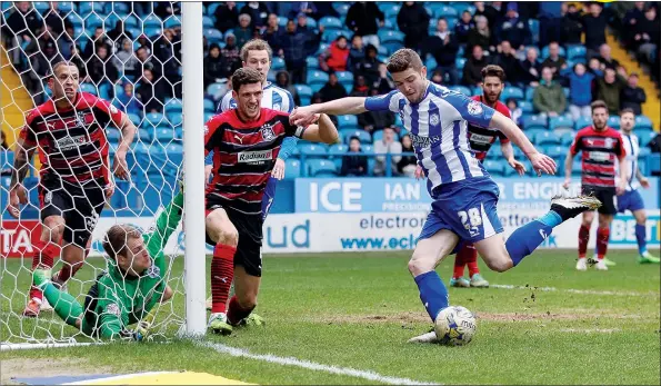  ?? PICTURES: Pinnacle ?? DRIVEN HOME: Sergiu Bus thinks he has sealed Sheffield Wednesday all three points with his goal on 86 minutes