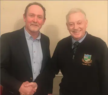  ??  ?? Incoming Captain Liam Horgan received the Captains Blazer for 2020 at the Baltinglas­s Golf Club AGM from Club Captain Martin Hennessy.