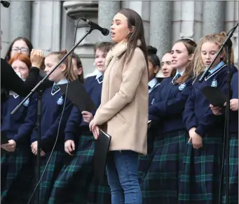  ??  ?? Amie Dyer singing with the Greenhills choir for World Suicide Prevention day