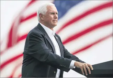  ??  ?? Vice President Mike Pence looks on during a break in his speech at a Republican campaign rally in Belgrade, Mont., on Sept. 14.