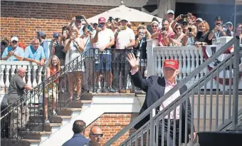  ?? KELVIN KUO, USA TODAY SPORTS ?? President Donald Trump waves to the crowd Sunday during the final round of the U. S. Women’s Open golf tournament at Trump National Golf ClubNew Jersey.