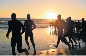  ??  ?? THE JOURNEY STARTS: Tri-athletes at the start of the Nelson Mandela Bay Ironman 2019 at the weekend.