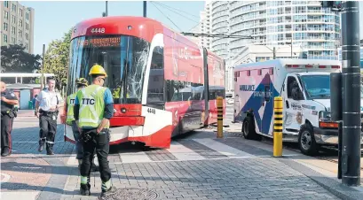  ?? KELSEY WILSON PHOTOS TORONTO STAR ?? A TTC streetcar derailed on Queens Quay W. at York St. after a collision with an ambulance on Wednesday morning.