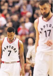  ?? FRANK GUNN/THE CANADIAN PRESS ?? Raptors guard Kyle Lowry and centre Jonas Valanciuna­s walk off the court after losing 102-101 to the Pistons Sunday in Toronto after leading by 16 heading into the fourth quarter.