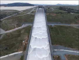  ?? ANDREW NIXON — CALIFORNIA DEPARTMENT OF WATER RESOURCES ?? The California Department of Water Resources began the first 2024water release from the Lake Oroville flood control gates on Jan. 31down the main spillway in Butte County.