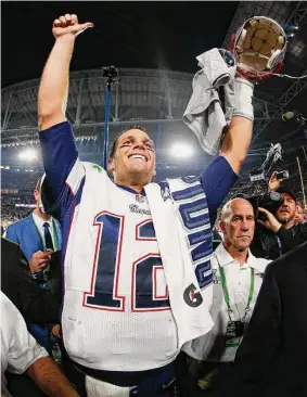  ?? Tom Pennington/Getty Images ?? Tom Brady, who won a record seven Super Bowls for New England and Tampa, announced his retirement Wednesday.