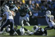  ?? MARK J. TERRILL — THE ASSOCIATED PRESS ?? Philadelph­ia Eagles running back Corey Clement (30) runs during the second half of an NFL football game against the Los Angeles Chargers Sunday in Carson, Calif.