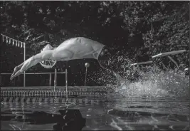  ?? Photo courtesy of Haley Hamaker ?? Clune practices his 100 backstroke start off the block.