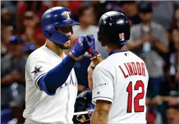  ?? AP PHOTO BY JOHN MINCHILLO ?? American League’s Joey Gallo, left, of the Texas Rangers, is congratula­ted by American League teammate Francisco Lindor, of the Cleveland Indians, after Gallo hit a solo home run during the seventh inning of the MLB baseball All-star Game, Tuesday, in Cleveland.