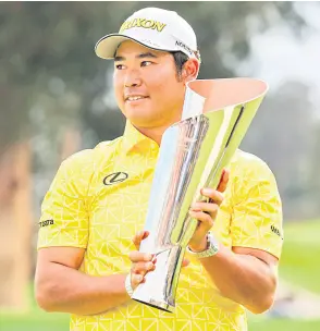  ?? — AFP photo ?? Matsuyama poses for a photo with the trophy after putting in to win on the 18th green during the final round of The Genesis Invitation­al at Riviera Country Club in Pacific Palisades, California.