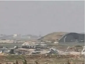  ??  ?? A still image taken from a video broadcast on Syrian state television shows a Syrian army airbase that was hit by a US strike near the city of Homs.