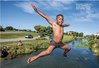  ??  ?? Bill Taulele, 8, heads for a cooling splashdown in Marlboroug­h yesterday. RICKY WILSON / STUFF