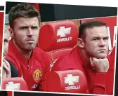  ??  ?? WAYNE ROONEY cut a sorry figure as a glorified ball boy (left) before he watched the game from the bench with Michael Carrick (above). Jose Mourinho (below) then gave some late tips before Rooney came on for the last 10 minutes against Leicester