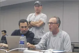  ?? Pete Dougherty / Times Union ?? Play-by-play announcer Joe Tessitore, left, checks with producer Jay Rothman, center, and director Chip Dean at their Monday meeting.