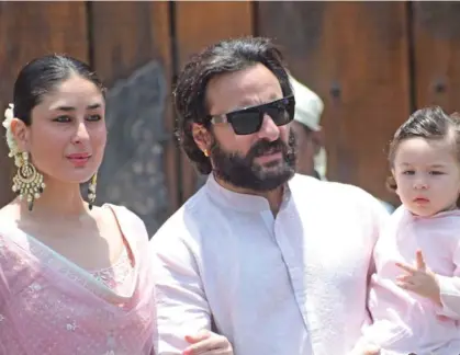  ??  ?? Kareena Kapoor Khan along with husband Saif Ali Khan and son Taimur at Sonam Kapoor’s wedding.