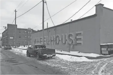  ?? TOM DAYKIN / MILWAUKEE JOURNAL SENTINEL ?? Wheelhouse, a new Milwaukee small business center, is at the corner of N. Holton and E. Townsend streets. It is just across Holton St. from Riverworks Lofts apartments (background).