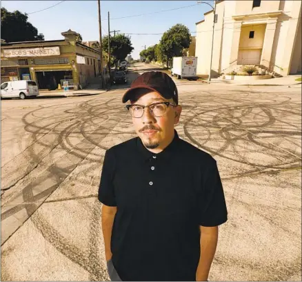  ?? Al Seib Los Angeles Times ?? “THE FAST and the Furious” fan Shea Serrano in front of the film’s “Toretto’s Market,” actually Bob’s Market in Angelino Heights.