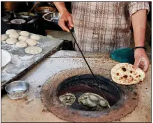  ?? (The New York Times/Poras Chaudhary) ?? Rotis are on the menu
at the Verma dhaba roadside restaurant near Palampur in Himachal Pradesh, India.