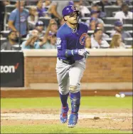  ?? Kathy Willens / Associated Press ?? Javier Baez of the Cubs watches his tworun home run during the sixth inning of Tuesday’s game against the Mets in New York.