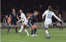  ?? IAN MACNICOL/GETTY IMAGES ?? The United States’ Alex Morgan (13) scores the opening goal during an internatio­nal friendly against Scotland on Tuesday.