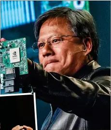  ??  ?? ROW: Nvidia’s Jensen Huang and Arm co-founder Hermann Hauser, left,