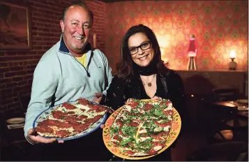  ?? Erik Trautmann / Hearst Connecticu­t Media ?? Coals Grilled Pizza owners Joe Rossi and Blanca Restaino Tuesday at the restaurant in Norwalk. Coals Grilled Pizza, which has locations in Westcheste­r, opened their new location on Wall Street last Friday. It's the group's first location in Fairfield County/Connecticu­t and replaces Fat Cat Pizzeria which closed on Wall Street last year.