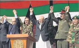  ?? Lolita Baldor Associated Press ?? AFGHAN President Ashraf Ghani, third from right, is f lanked by top U.S. and Afghan military officials Sunday at a special-operations ceremony near Kabul.