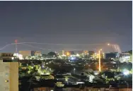  ?? (Amir Cohen/Reuters) ?? IRON DOME MISSILES are launched near Ashkelon yesterday.