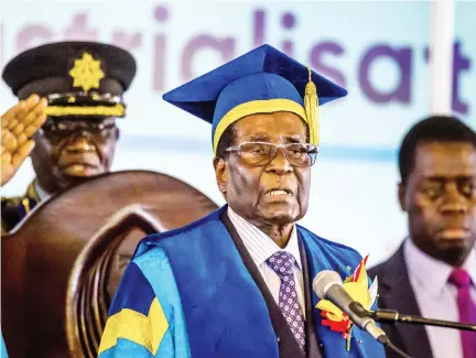  ??  ?? Zimbabwe’s President Robert Mugabe delivers a speech during a graduation ceremony at the Zimbabwe Open University in Harare, where he presides as the Chancellor on Friday. (AFP)