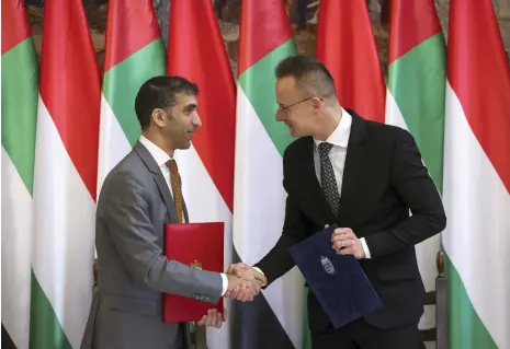  ?? AP Photo ?? Thani Al Zeyoudi, Minister of State for Foreign Trade, and Peter Szijjarto, Hungary’s Minister of Foreign Affairs and Trade