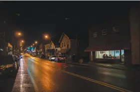  ?? MADDIE MCGARVEY / THE NEW YORK TIMES ?? Downtown East Palestine, Ohio, is pictured on a recent evening. The National Transporta­tion Safety Board has not yet released the cause of the train derailment that landed East Palestine in the national spotlight nearly a month ago.