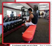  ?? ASSOCIATED PRESS PHOTO ?? A customer works out at a Snap Fitness truck stop gym in Dallas. From trucking companies embracing wellness and weight- loss programs to gyms being installed at truck stops, momentum has picked up in recent years to help those who make their living...