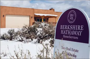  ?? DANIEL PEARSON/Taos News ?? Berkshire Hathaway HomeServic­es has a home up for sale on Eototo Road, as seen Tuesday (March 26).